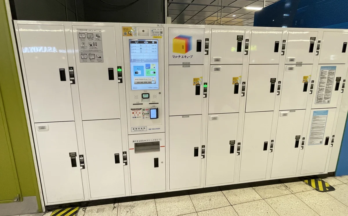 White Multi Ecube coin lockers at Shinjuku Station with a touch panel